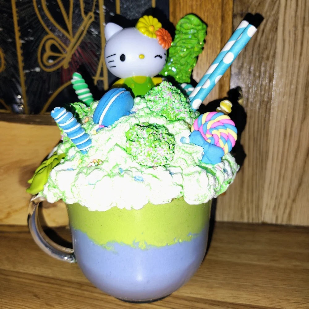 Colorful Character Cake Topper with Green and Blue Accents